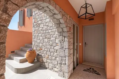 an archway in a house with a vase next to a door at Rhodes Island View in Ixia