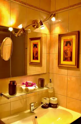a bathroom with a sink and a mirror at Carmen Art Hotel in Rhodes Town