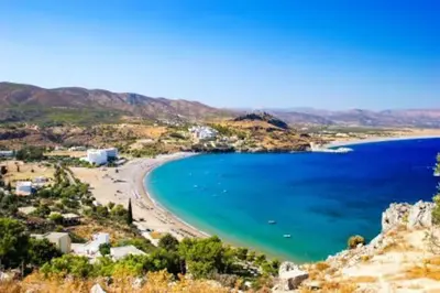a view of a beach with boats in the water at Aleyna house Lindos area in Líndos