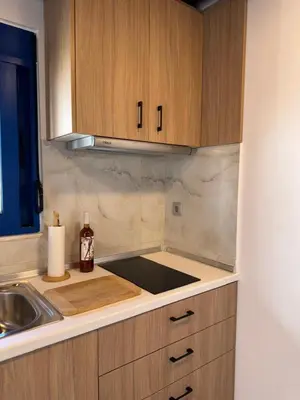 a kitchen with a sink and a counter top at Aleyna house Lindos area in Líndos
