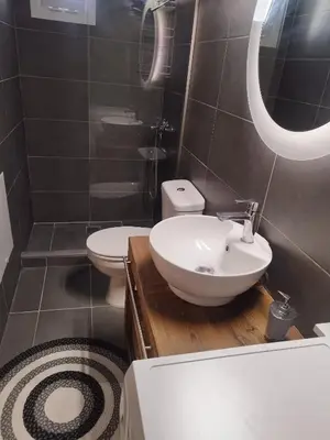 a bathroom with a sink and a toilet at Melograno di Rodi 4 in Rhodes Town
