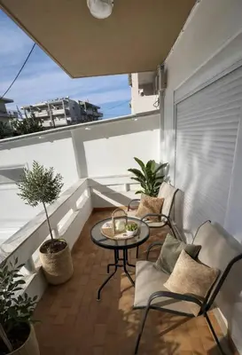 a balcony with chairs and a table on a roof at Melograno di Rodi 4 in Rhodes Town