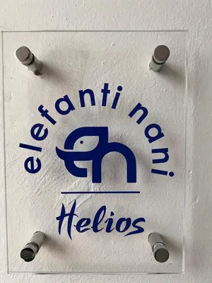 a sign for a canton hospital helios at Elefanti Nani in Livadia