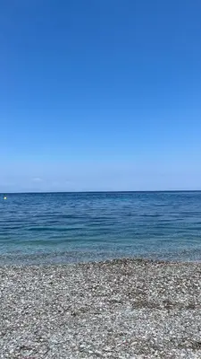 a rocky beach with the ocean in the background at Elefanti Nani in Livadia