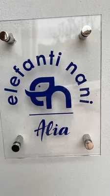 a sign on a wall with the name of aania at Elefanti Nani in Livadia