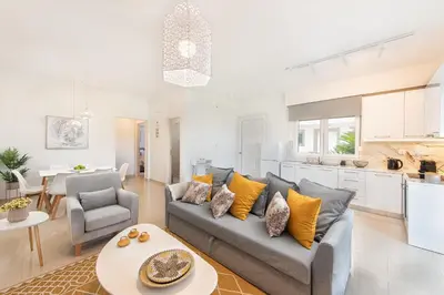 a living room with a couch and a table at Island Hills in Rhodes Town