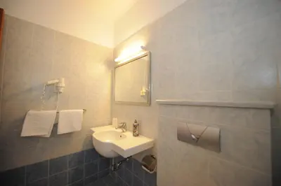 a bathroom with a sink and a mirror at Golden View Studios in Líndos