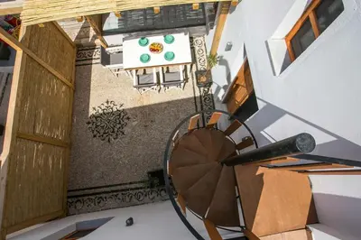 an overhead view of a balcony with a wheel at Pera houses 2-bedroom in the center of Lindos in Líndos