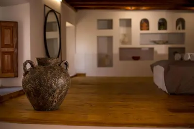 a vase sitting on a table in a room at Pera houses 2-bedroom in the center of Lindos in Líndos