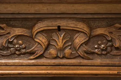 a wooden carving of flowers on a wall at Niochori Heritage: The Mermaid Suite in Rhodes Town
