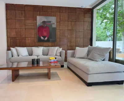a living room with a couch and a coffee table at Angela Downtown Hotel in Rhodes Town