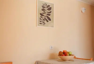 a bowl of fruit sitting on top of a table at Beautiful penthouse studio for 2 in Archangelos
