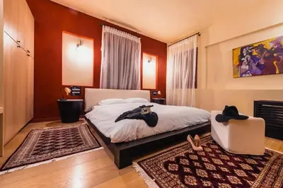 a bedroom with a bed with a hat on it at Avalon Boutique Hotel Rhodes in Rhodes Town