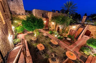 an overhead view of a patio with tables and chairs at Avalon Boutique Hotel Rhodes in Rhodes Town