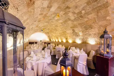 a dining room with white tables and chairs at Avalon Boutique Hotel Rhodes in Rhodes Town