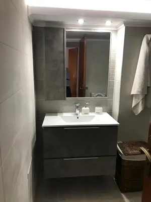 a bathroom with a sink and a mirror at Jacob Apartments in Center of Rhodes in Rhodes Town