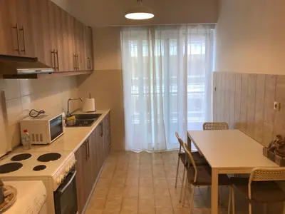 a kitchen with a table and a stove top oven at Jacob Apartments in Center of Rhodes in Rhodes Town
