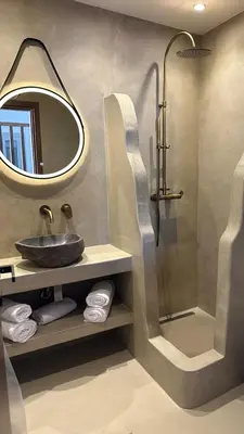 a bathroom with a sink and a shower at Amalthea Luxury Suites in Symi