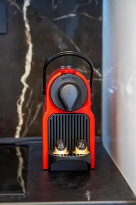 a red toaster sitting on top of a table at Luxury Loft in the center in Rhodes Town