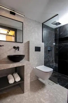 a bathroom with a sink and a toilet and a shower at Luxury Loft in the center in Rhodes Town