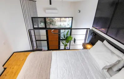 a bedroom with a large bed with a window at Luxury Loft in the center in Rhodes Town