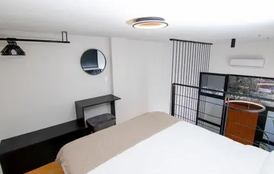 a bedroom with a white bed and a window at Luxury Loft in the center in Rhodes Town