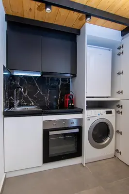 a kitchen with a washing machine and a washer at Luxury Loft in the center in Rhodes Town