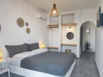 a bedroom with a large bed in a room at Rhodes Soul Luxury Suites in Afantou