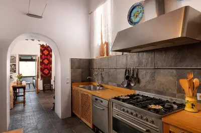 a kitchen with a stove and a sink at Villa Venetoklis in Líndos
