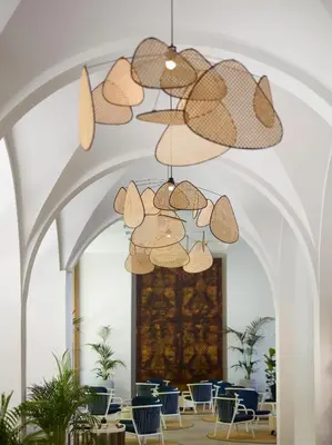 a large room with chairs and a chandelier at Amus Hotel & Spa in Ixia