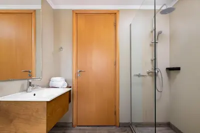 a bathroom with a sink and a shower at Diana Art Boutique Hotel in Rhodes Town