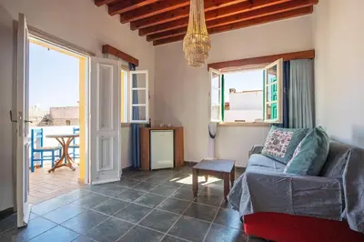 a living room with a couch and a table at Saint Artemios Boutique Hotel in Rhodes Town