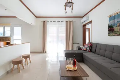 a living room with a couch and a table at Dim Domus _ Apolakkia, South Rhodes in Apolakkiá
