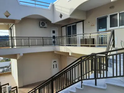 a balcony of a house with a staircase at Dim Domus _ Apolakkia, South Rhodes in Apolakkiá