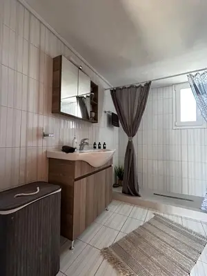 a bathroom with a sink and a tub and a shower at Dim Domus _ Apolakkia, South Rhodes in Apolakkiá