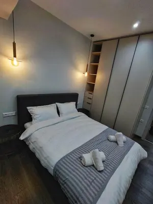 a bedroom with two stuffed animals on a bed at Mini City Escape in Rhodes Town