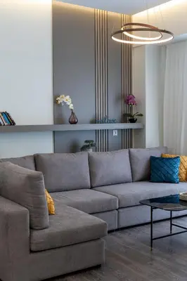 a living room with a couch and a table at Mini City Escape in Rhodes Town