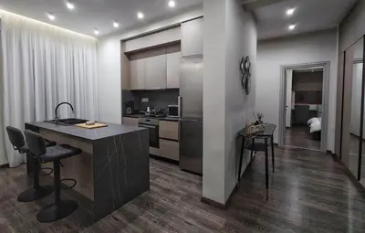 a kitchen with a island in a room at Mini City Escape in Rhodes Town