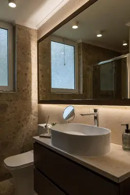 a bathroom with a large sink and a mirror at Mini City Escape in Rhodes Town