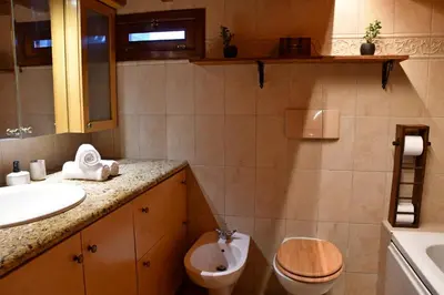 a bathroom with a toilet and a sink at The three story old town house in Rhodes Town
