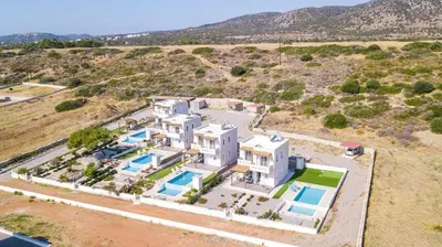 an aerial view of a large white house at Villa Regina - Luxury and Comfort in Lachania