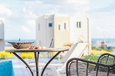 a table with a bowl of food on top of it at Villa Regina - Luxury and Comfort in Lachania