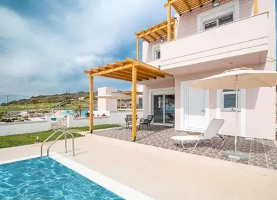 a villa with a swimming pool and a house at Villa Regina - Double Pool Paradise in Lachania