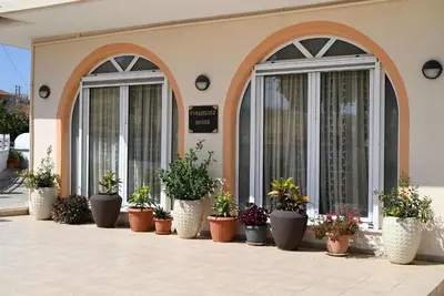 a row of potted plants on the side of a building at Evaggelia's Private House in Fanes Rhodes in Phanaes