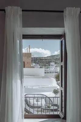 an open window with a view of a building at Kilistra Lindian Living in Líndos