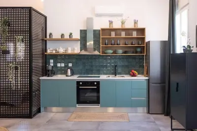 a kitchen with blue cabinets and a sink at Casa d'oro 56 Living in Paradisi Rhodes in Paradeísion