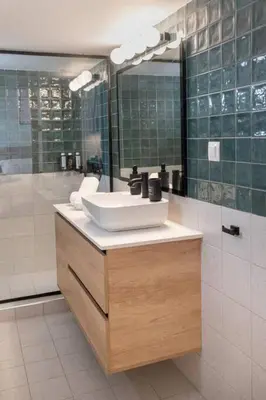 a bathroom with a sink and a mirror and a shower at Casa d'oro 56 Living in Paradisi Rhodes in Paradeísion
