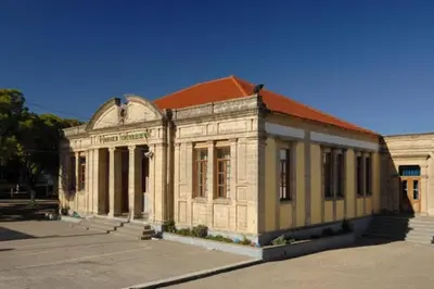an old building with a red roof in a parking lot at Casa d'oro 56 Living in Paradisi Rhodes in Paradeísion