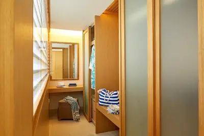 a bathroom with a vanity and a sink and a mirror at Lindos Blu Luxury Hotel-Adults only in Líndos