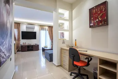 a home office with a desk and a chair at Anita Luxury Apartment in Rhodes Town